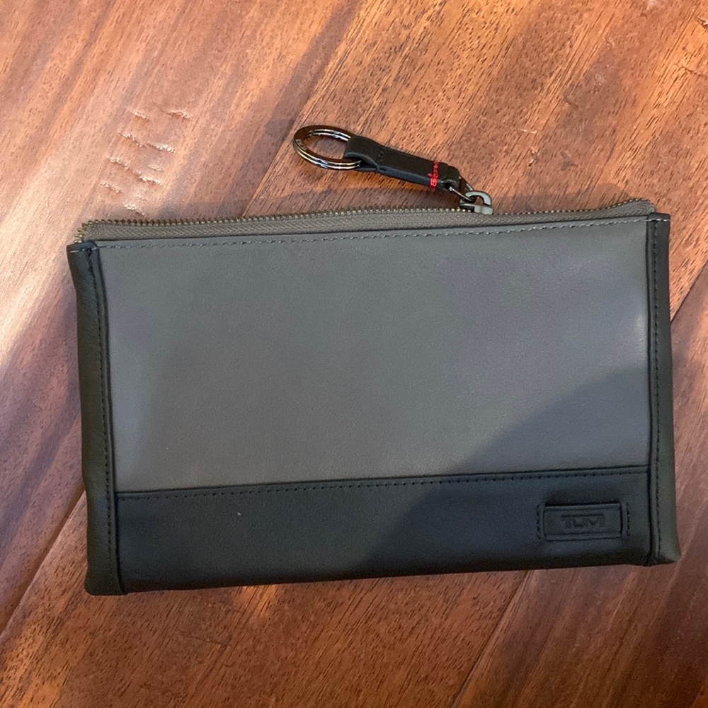 Brand new Tumi clutch